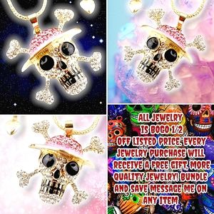 Gold plated pink and white crystal skull and crossbones with hat necklace